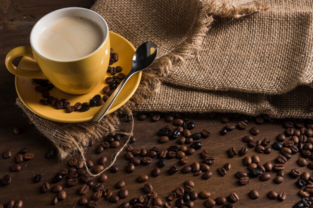 Coffee set on sackcloth near coffee beans