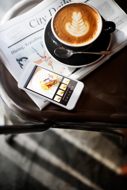 Free photo coffee shop cafe latte cappuccino newspaper concept