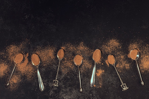 Coffee spoons on black background