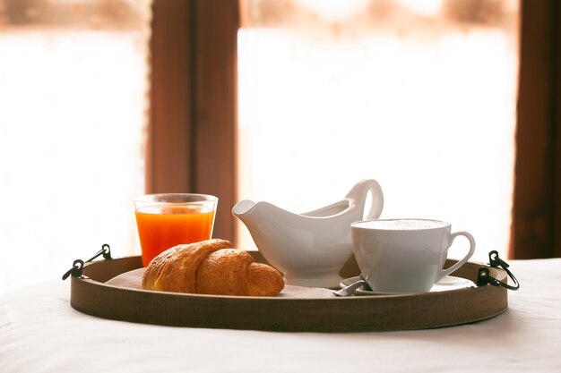 Coffee with croissant and orange juice