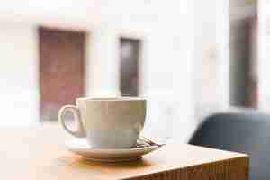 Free photo coffee on wooden table in caf� shop