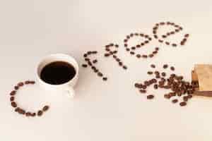 Free photo coffee written with coffee beans