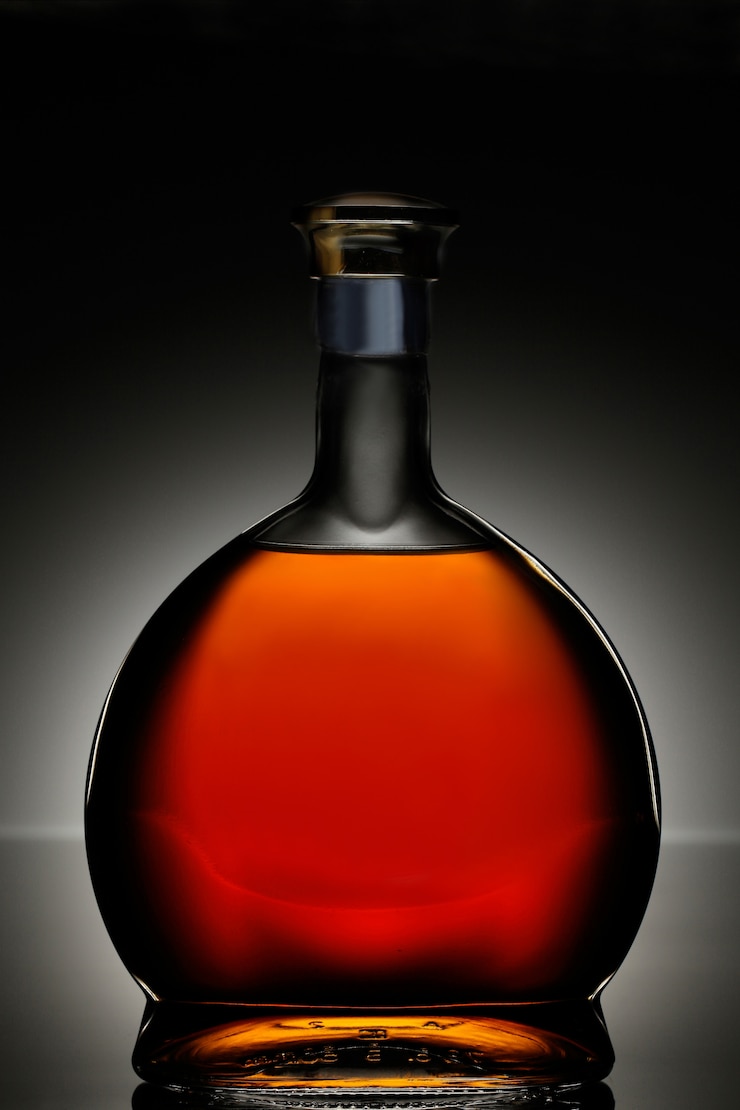 Free Photo cognac in oval bottle