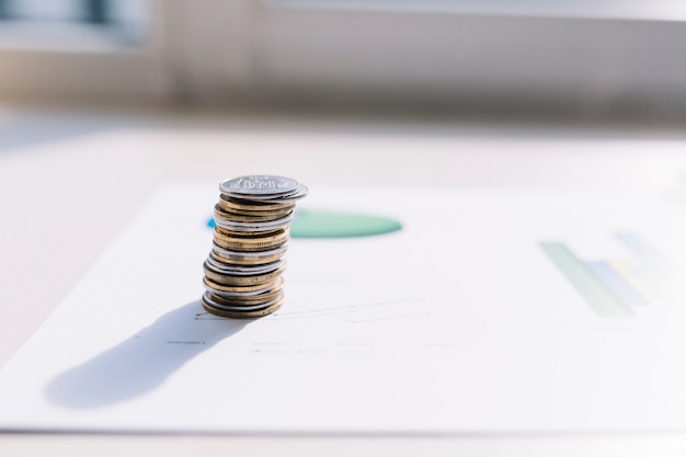 Free photo coin stack on graph over table