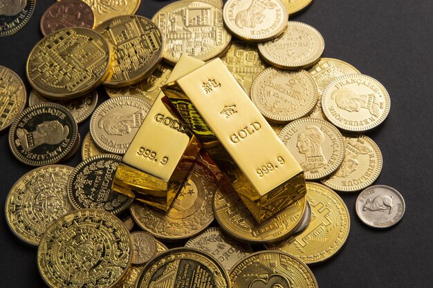 Coins, and gold bars scattered on a table