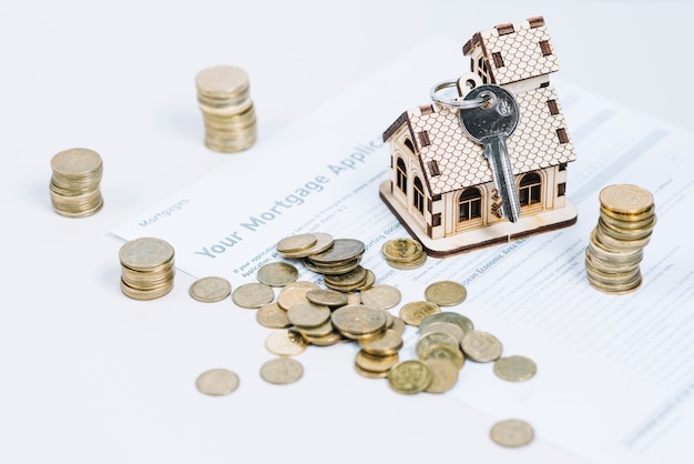 Coins and keys on mortgage application