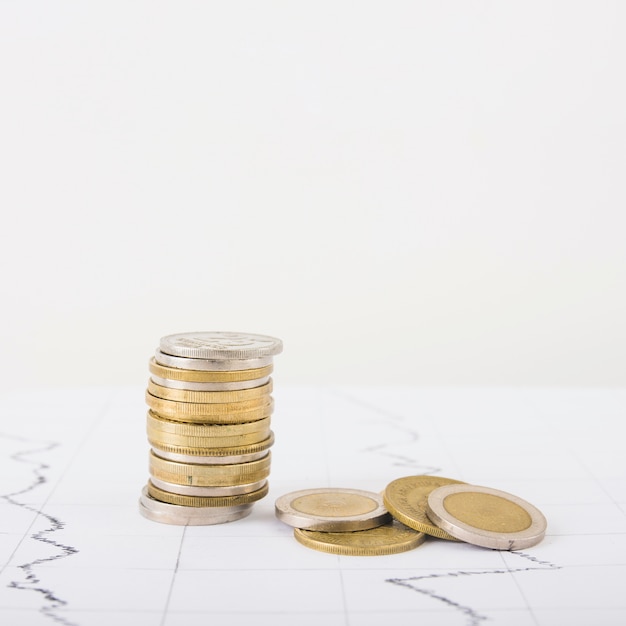 Coins stack on white table