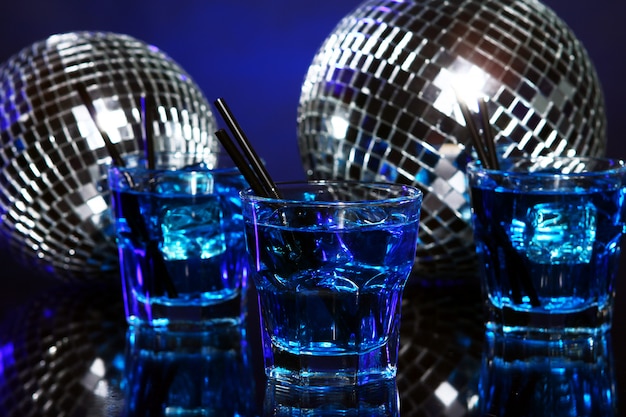Cold blue cocktail with disco ball