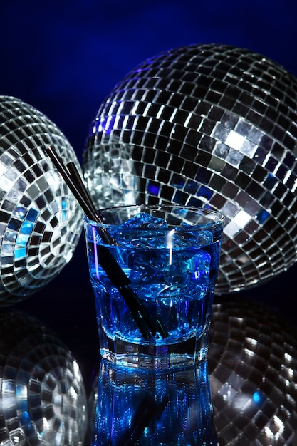 Free photo cold blue cocktail with disco ball