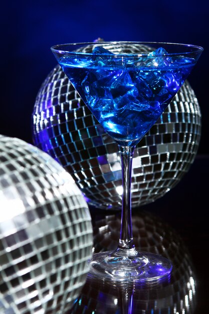 Cold blue cocktail with disco ball