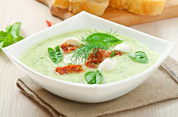 Cold cucumber soup with dried tomatoes and mozzarella