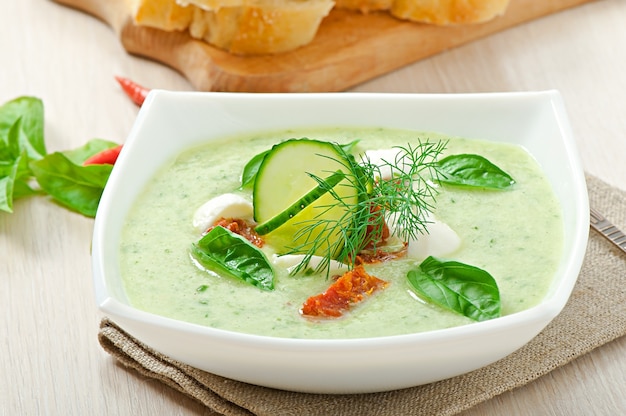 Free photo cold cucumber soup with dried tomatoes and mozzarella