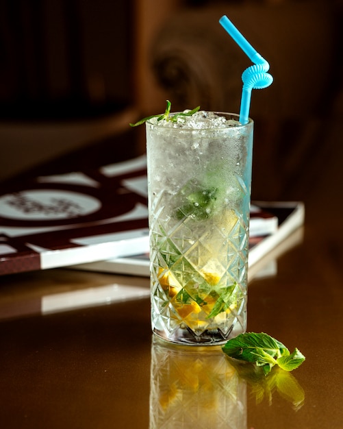 Cold drink with ice, mint leaves and lemon