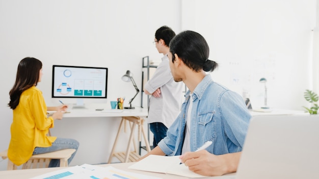 Free Photo collaborative process of multicultural businesspeople using laptop presentation and communication meeting brainstorming ideas about new project colleagues working plan success strategy in home office.