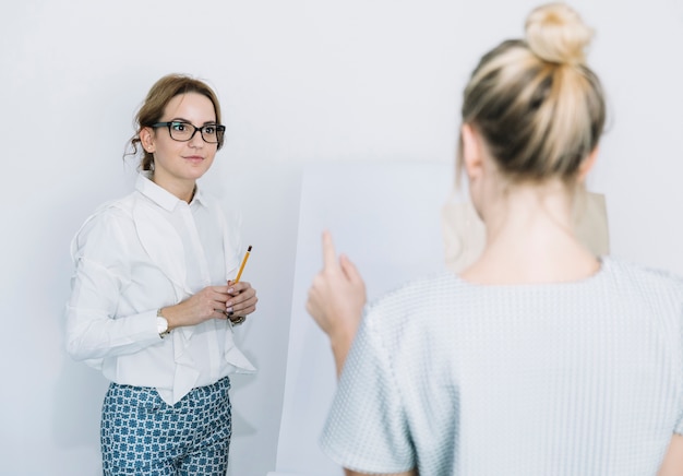 Colleague discussing planning work during meeting