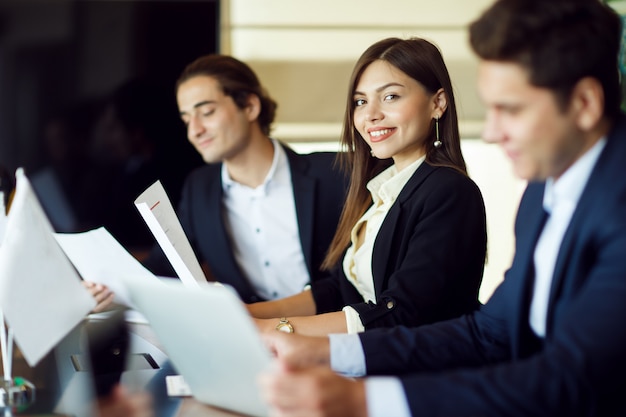 Colleagues in blurred shade in a meeting