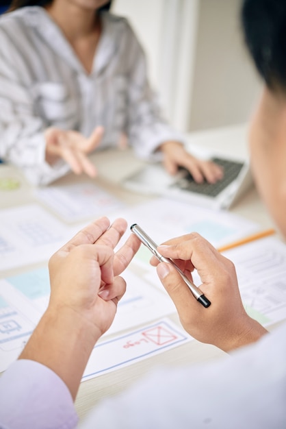 colleagues counting with fingers while working
