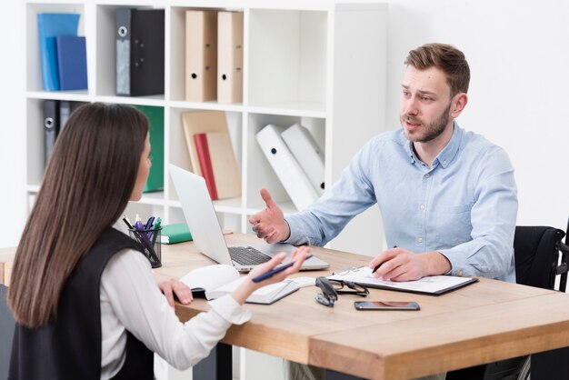 Colleagues discussing at work