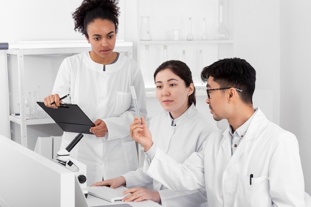 Colleagues in lab doing experiments