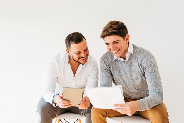 Colleagues looking over notes in office