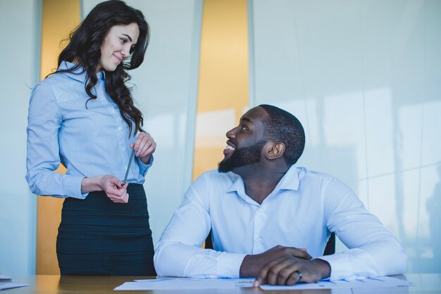 Colleagues smiling at each other