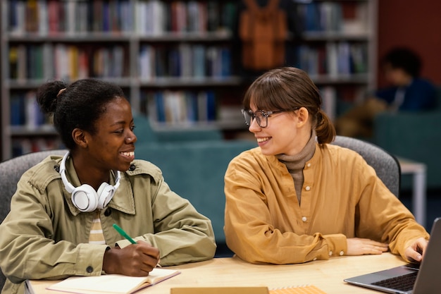 Colleagues studying in the university library