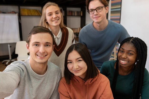 Colleagues taking a selfie together during group study