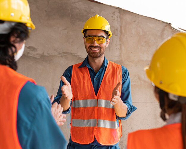 Colleagues with safety equipment