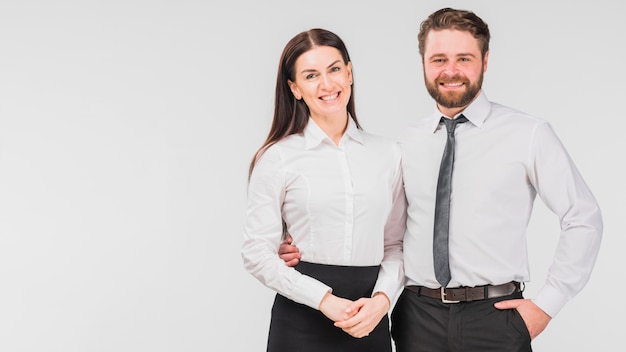 Colleagues woman and man embracing 