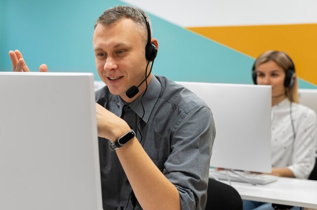 Colleagues working together in a call center office