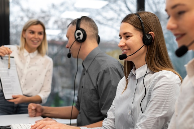 Colleagues working together in a call center office