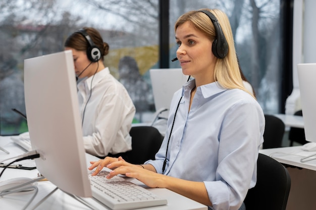 Colleagues working together in a call center office