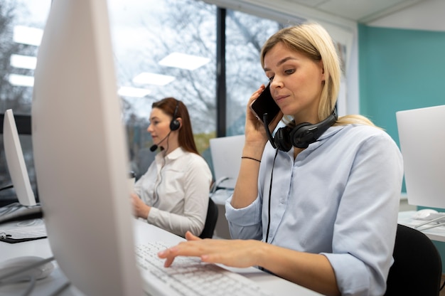 Colleagues working together in a call center office