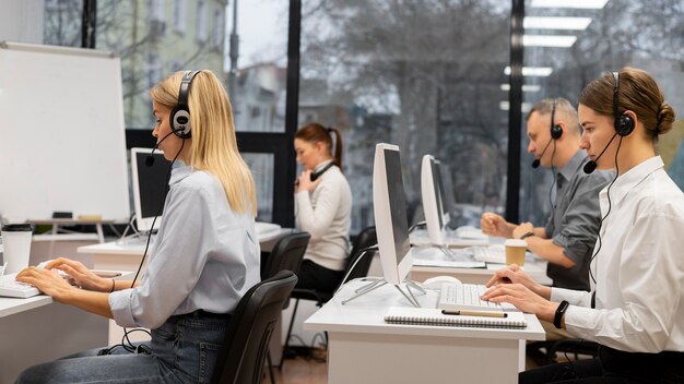 Colleagues working together in a call center office