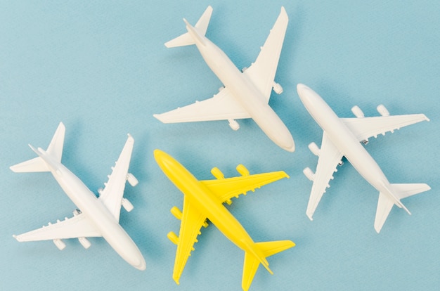 Collection of airplane toys with only a yellow one