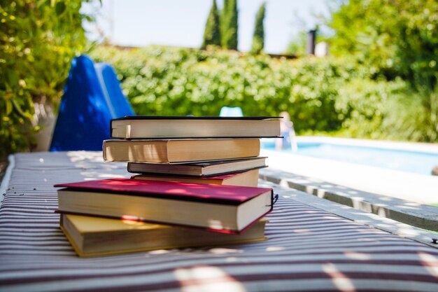 Collection of books put on feather bed