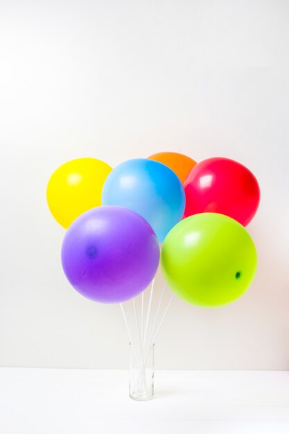 Collection of bright balloons in glass