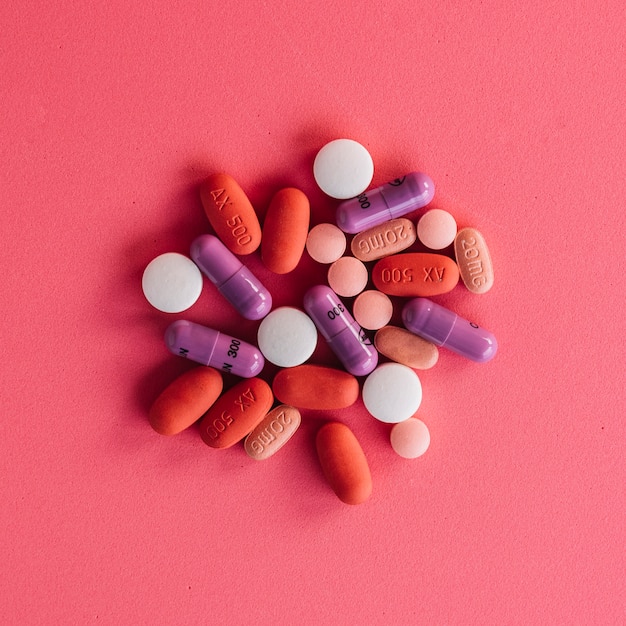 Free photo collection of colorful pills on bright background