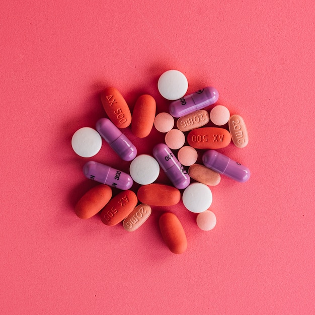 Collection of colorful pills on bright background