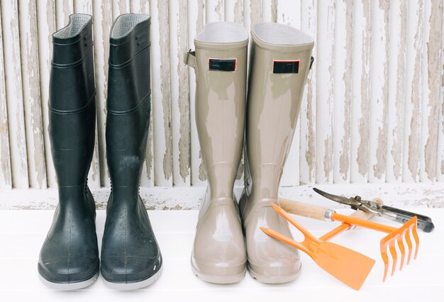 Collection of gardening boots and tools