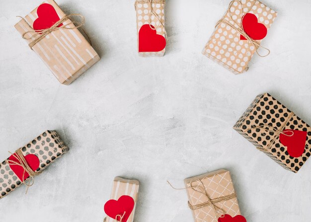 Collection of gift boxes in wrap with ornament paper hearts