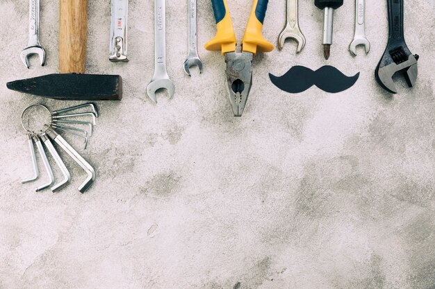 Collection of instruments near decorative moustache