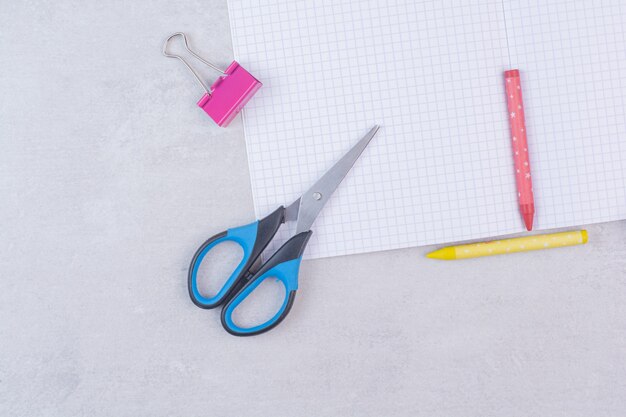 Collection of office supplies on white.