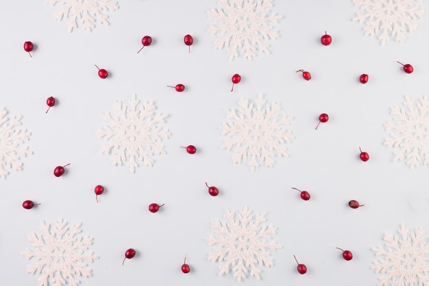 Collection of paper snowflakes and berries