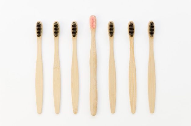 Collection of toothbrushes with only a pink one