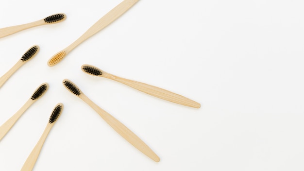 Collection of toothbrushes with only a yellow one