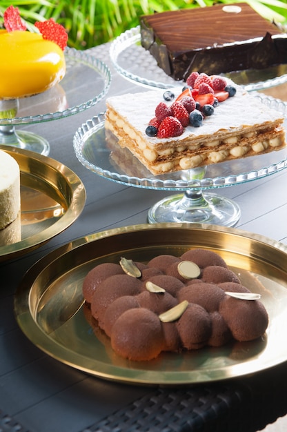 Collection of various cakes on table