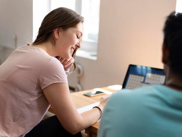 College girl and boy studying together