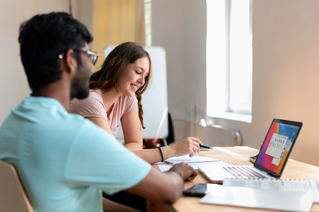 College girl and boy studying together