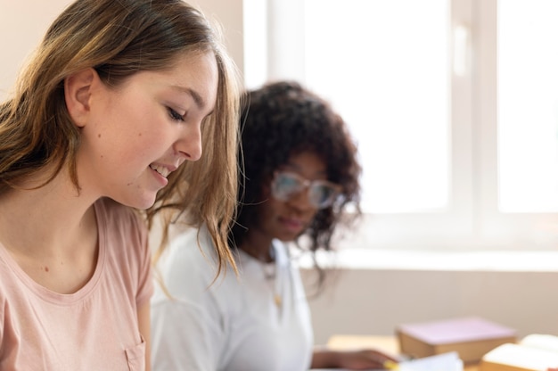 Free photo college girls studying together